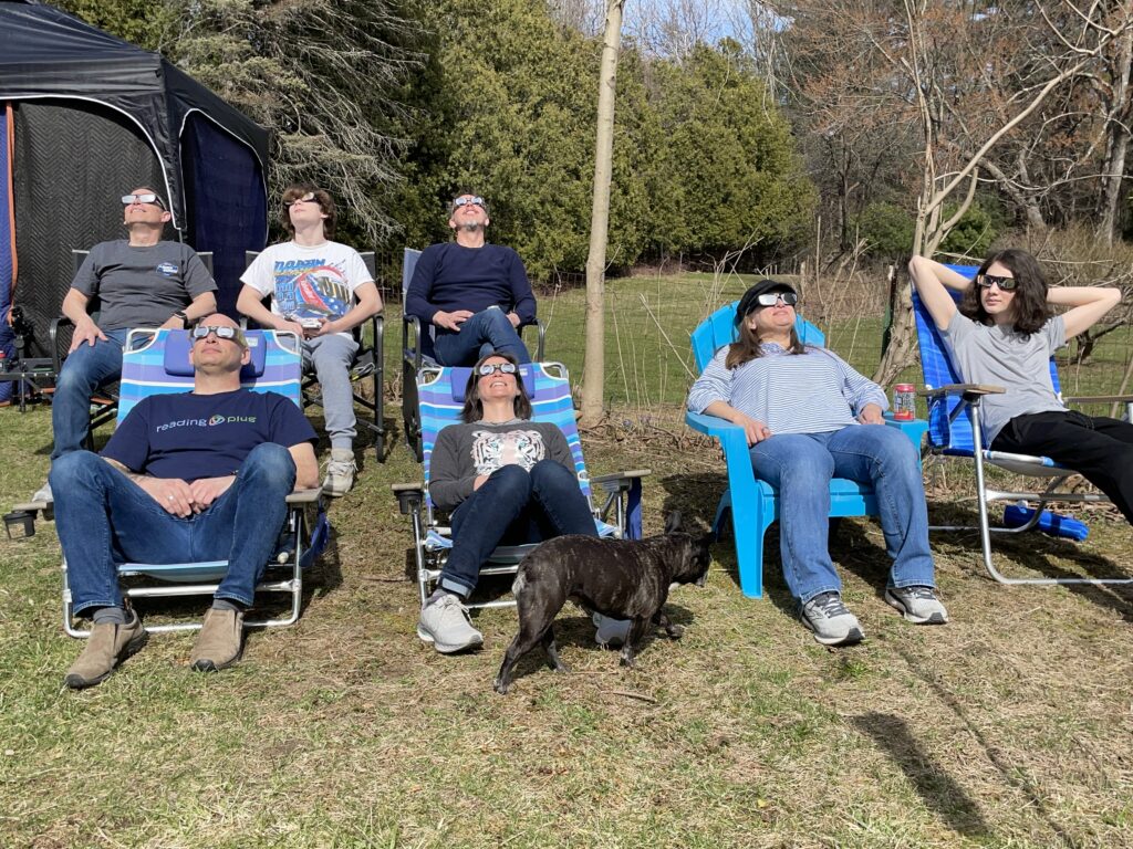 A group of people watching the eclipse in Vermont.